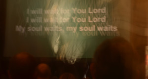 blurred photo of song words - I will wait for you Lord